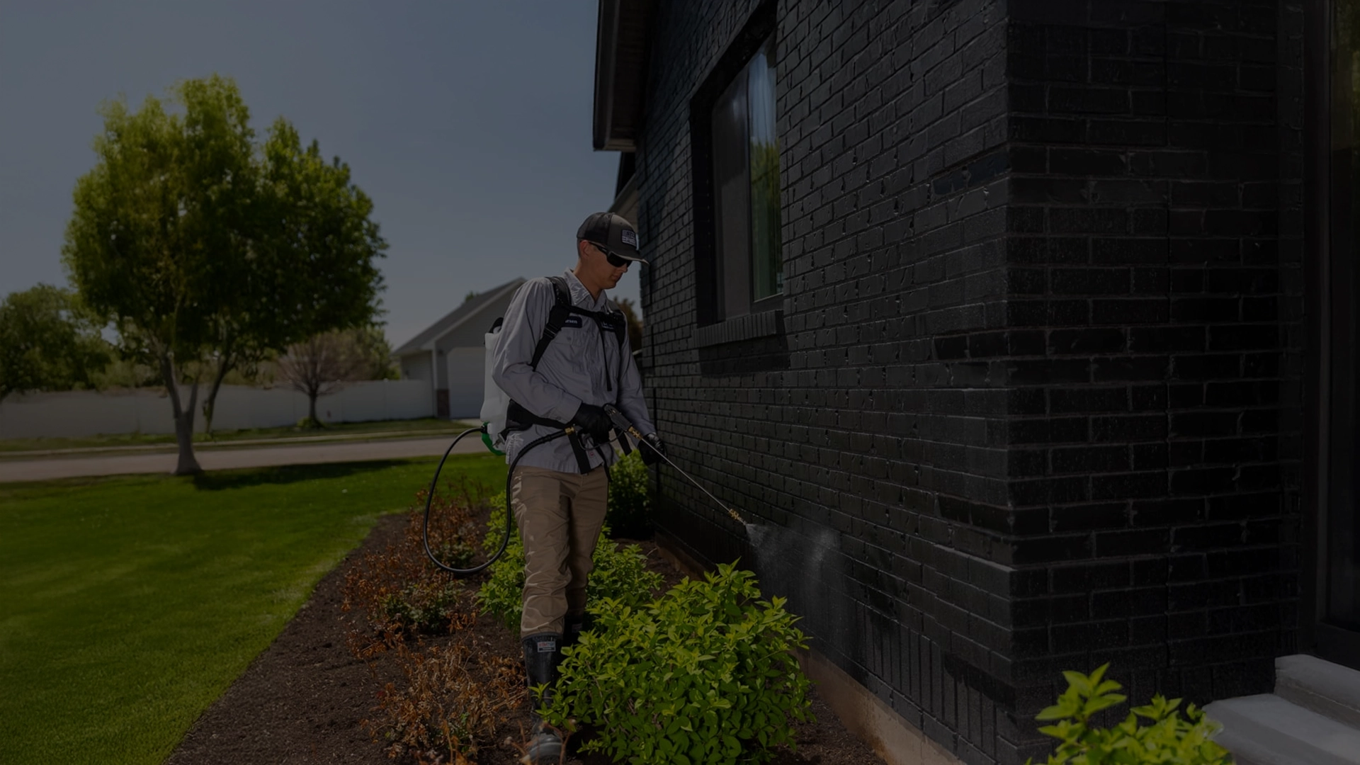 Technician spraying perimeter