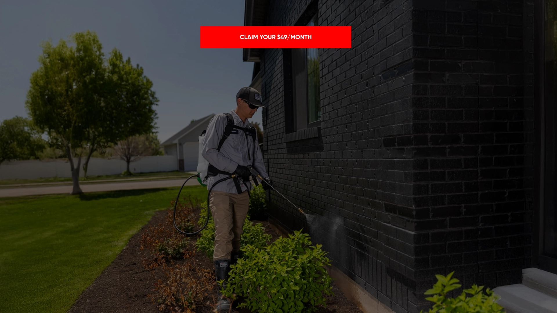 Technician spraying perimeter